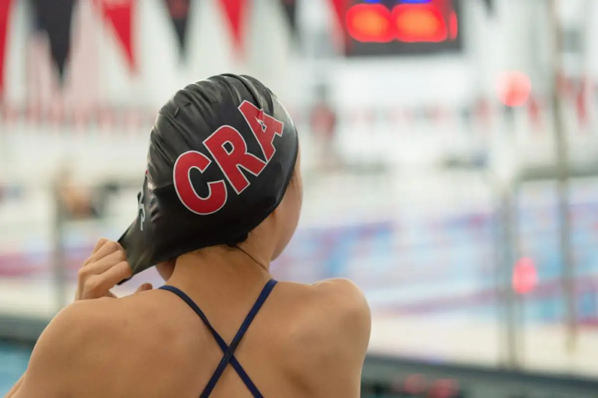Swimmer preparing for practice at the pool.