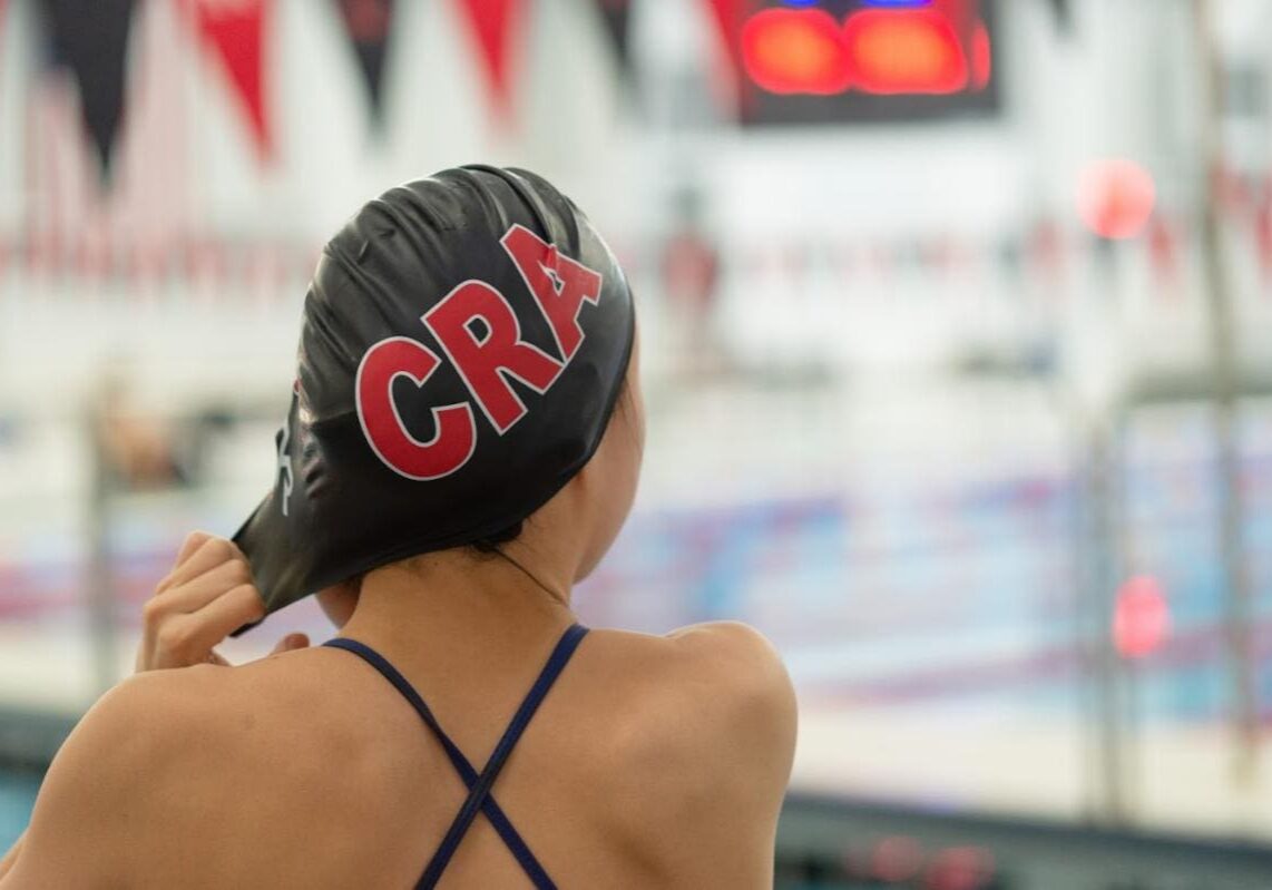 Swimmer preparing for practice at the pool.